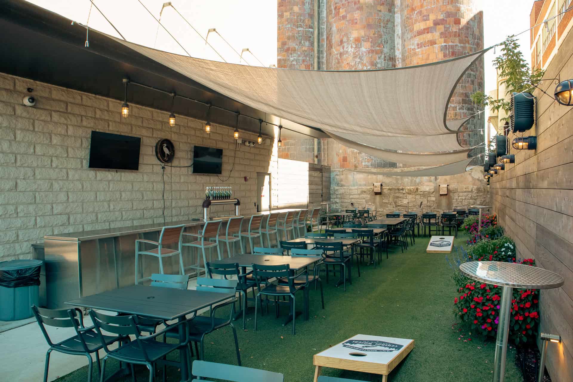 Expansive shaded turf space with optional cornhole